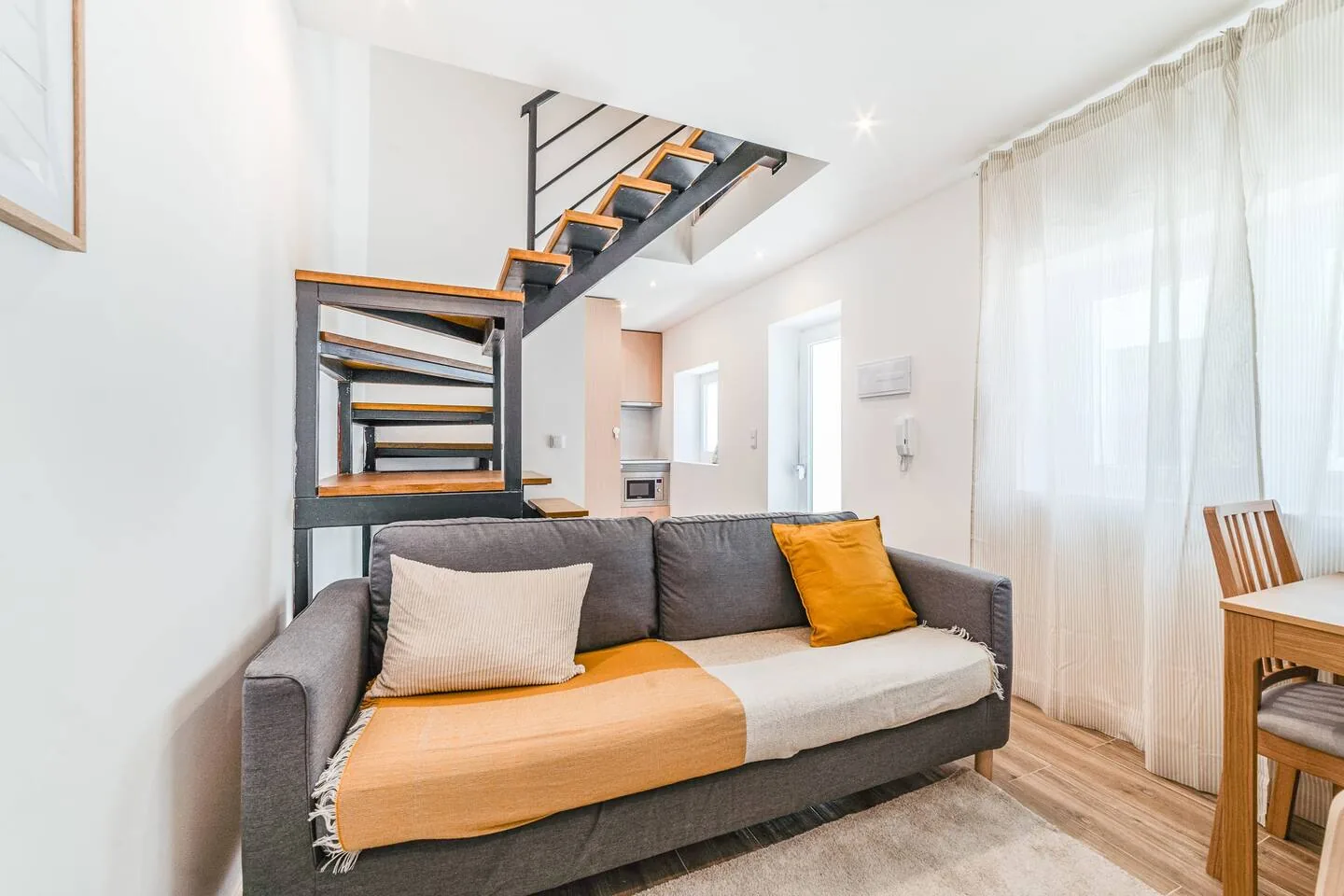 Living room of a Smith & Adams two-bedroom apartment in Campolide, Lisbon